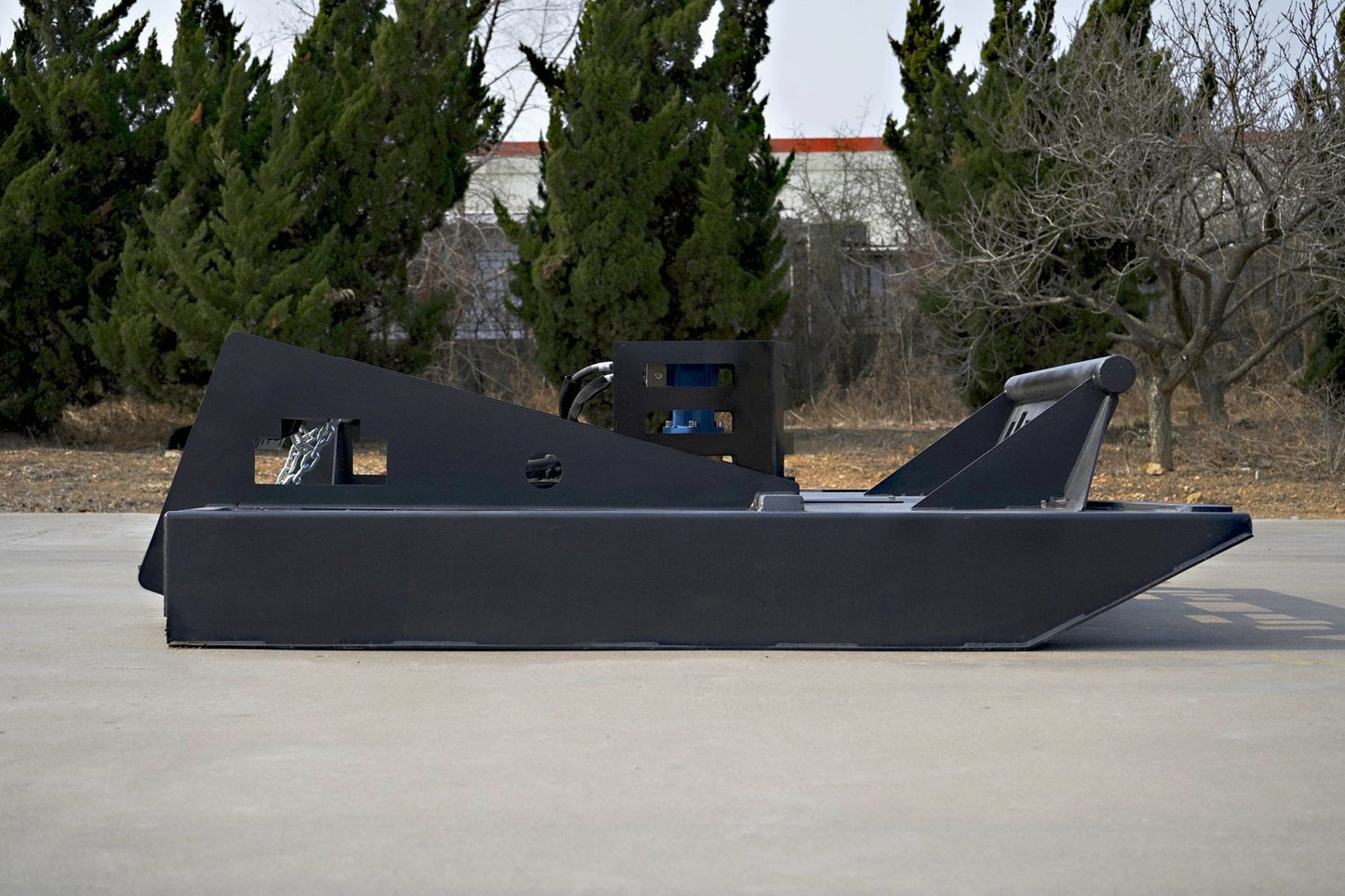 72 inch skid steer brush mower angled view

Underside of heavy-duty cutting blades

66 inch mower installed on skid steer

Skid steer clearing brush and saplings

Blade set and replacement part display