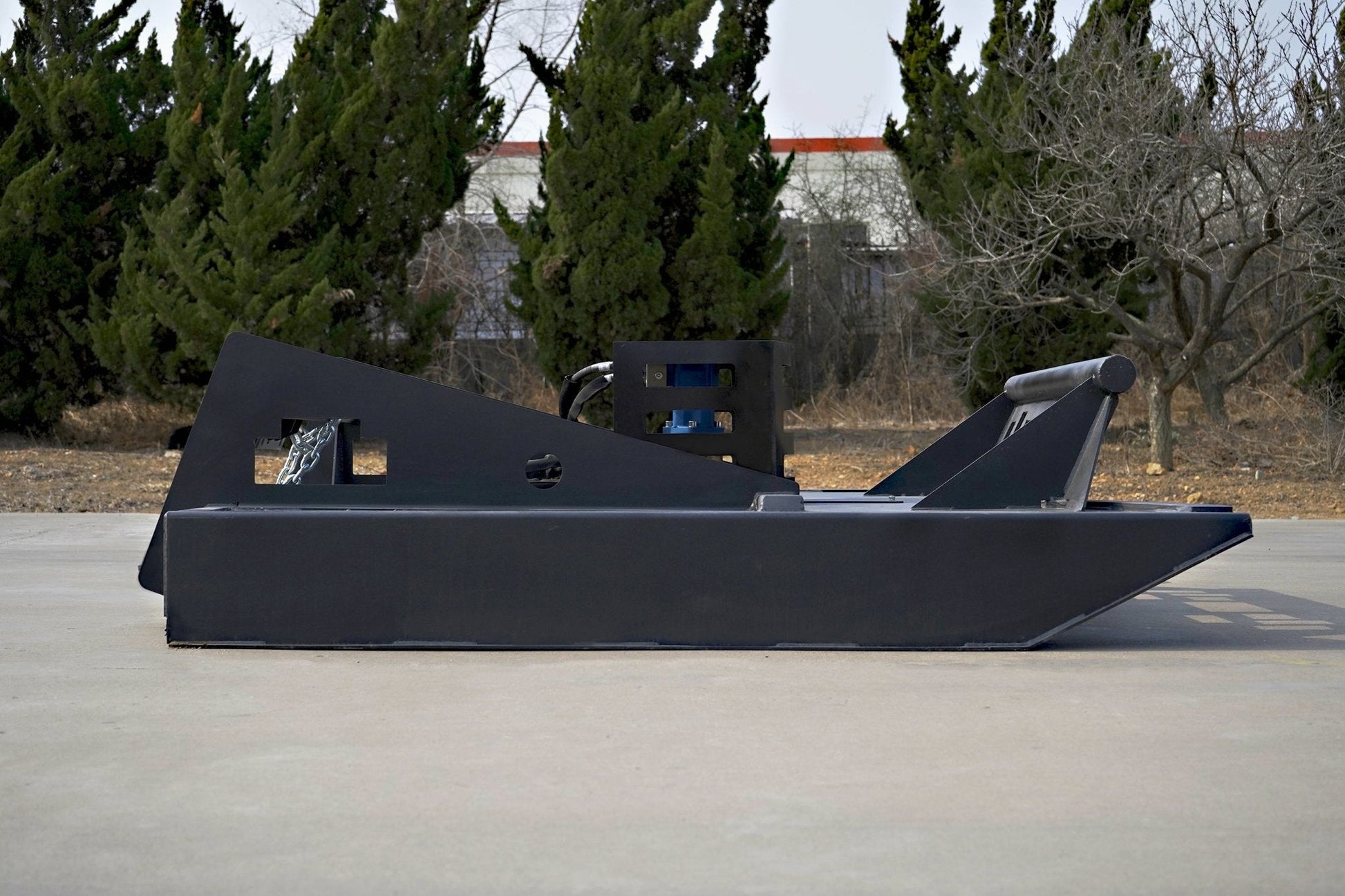 72 inch skid steer brush mower angled view

Underside of heavy-duty cutting blades

66 inch mower installed on skid steer

Skid steer clearing brush and saplings

Blade set and replacement part display