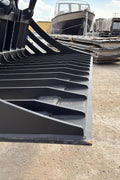 72" hydraulic grapple bucket on skid steer

Skid steer rock grapple front view

Close-up of grapple teeth and hoses

Dual-cylinder grapple open position

Grapple attachment lifting heavy debris