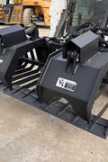 72" hydraulic grapple bucket on skid steer

Skid steer rock grapple front view

Close-up of grapple teeth and hoses

Dual-cylinder grapple open position

Grapple attachment lifting heavy debris