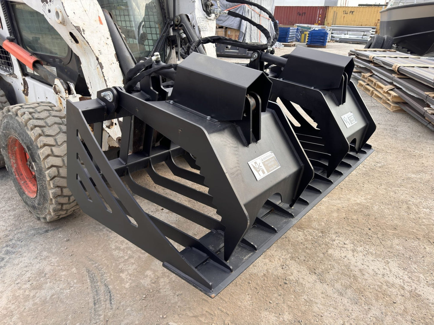 72" hydraulic grapple bucket on skid steer

Skid steer rock grapple front view

Close-up of grapple teeth and hoses

Dual-cylinder grapple open position

Grapple attachment lifting heavy debris