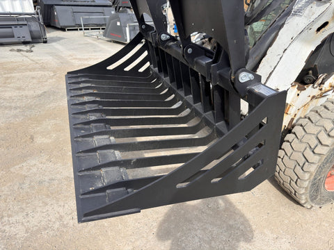 72" hydraulic grapple bucket on skid steer

Skid steer rock grapple front view

Close-up of grapple teeth and hoses

Dual-cylinder grapple open position

Grapple attachment lifting heavy debris