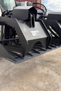 72" hydraulic grapple bucket on skid steer

Skid steer rock grapple front view

Close-up of grapple teeth and hoses

Dual-cylinder grapple open position

Grapple attachment lifting heavy debris