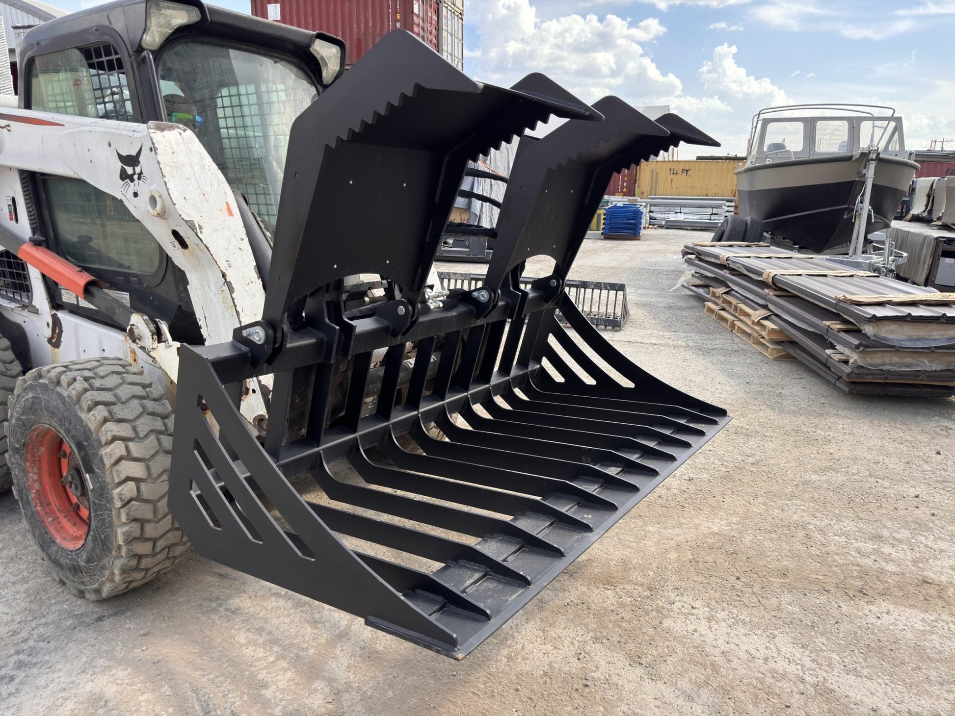 72" hydraulic grapple bucket on skid steer

Skid steer rock grapple front view

Close-up of grapple teeth and hoses

Dual-cylinder grapple open position

Grapple attachment lifting heavy debris