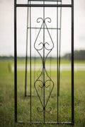 Black steel garden arbor arch in the outdoor lawn

Powder-coated metal trellis arch with decorative side panels

77-inch outdoor wedding arch for garden ceremonies

Steel arbor for roses and climbing vines

Decorative garden arch black steel frame assembled in the yard