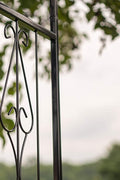 Black steel garden arbor arch in the outdoor lawn

Powder-coated metal trellis arch with decorative side panels

77-inch outdoor wedding arch for garden ceremonies

Steel arbor for roses and climbing vines

Decorative garden arch black steel frame assembled in the yard