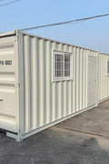 Gray 7FT steel office container with side door and windows
Interior view of 12FT jobsite office sea container
Office container unit with swing door and locking system
Plywood flooring inside portable office container
Security window with locking bar on steel sea container