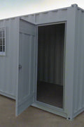 Gray 7FT steel office container with side door and windows
Interior view of 12FT jobsite office sea container
Office container unit with swing door and locking system
Plywood flooring inside portable office container
Security window with locking bar on steel sea container