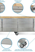 Close-up of smooth ball bearing drawer slides. Industrial stainless tool bench in workshop setup

