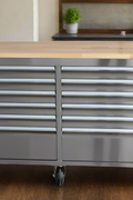 Front view of 8 FT stainless steel tool bench with 24 drawers