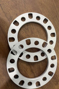8-lug universal aluminum wheel spacers front view

High-quality lightweight 12mm truck wheel spacer set

Precision drilled bolt holes in 8-lug wheel spacer

Spacer inner diameter and bolt pattern detail

Side-by-side wheel spacer comparison for trucks