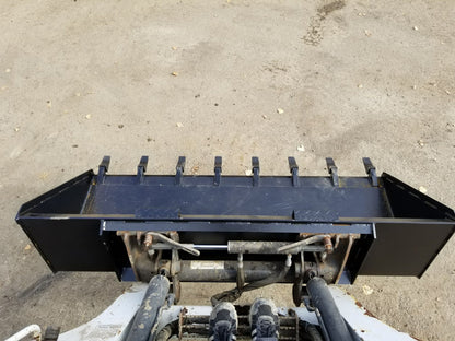 80" skid steer digging bucket with removable teeth

Heavy-duty bucket on job site with loader

Front view of 84-inch skid steer bucket

Skid steer digging into dirt with steel bucket

Wear strips and teeth close-up for material handling