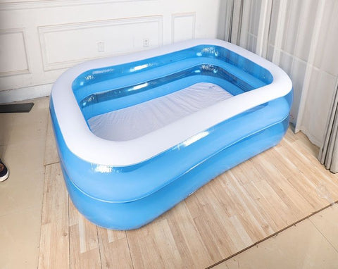 80 inch inflatable swimming pool – full top view

Inflated blue family pool on backyard grass

Folded pool with included storage bag

Kids splashing in inflatable rectangular pool

Side view of inflated rectangular pool