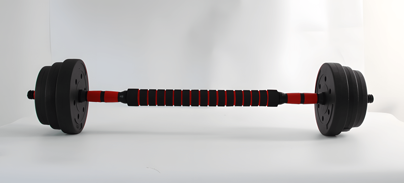 80 lb adjustable dumbbell set with textured grip and black weight plates
Pair of dumbbells with spinlock collars and metal connector bar
Full set of adjustable weight plates with barbell conversion chart