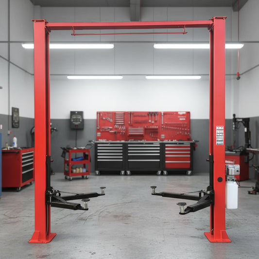 Red 2-post car hoist installed in garage

Close-up of safety lock and lift arms

Base of the lift showing manual release system

Top bar and symmetrical arm configuration