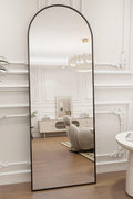 “Arched full-length mirror with black frame beside potted plant”

“Bedroom setup featuring full-length arched mirror against white wall”

“Arched mirror wall mounted in hallway entrance”

“Black-framed modern mirror with standing support in bedroom”

“Close-up of 58x18 mirror frame and edge details”