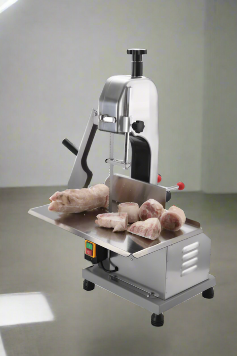 Full front view of a commercial frozen meat and bone saw machine
Side angle of a stainless steel cutting saw in a commercial kitchen
Bone saw machine in use, cutting frozen meat
Operator slicing frozen beef bones with an electric meat saw
Commercial food processing bone cutting equipment in operation
Close-up of adjustable blade on automatic bone saw
