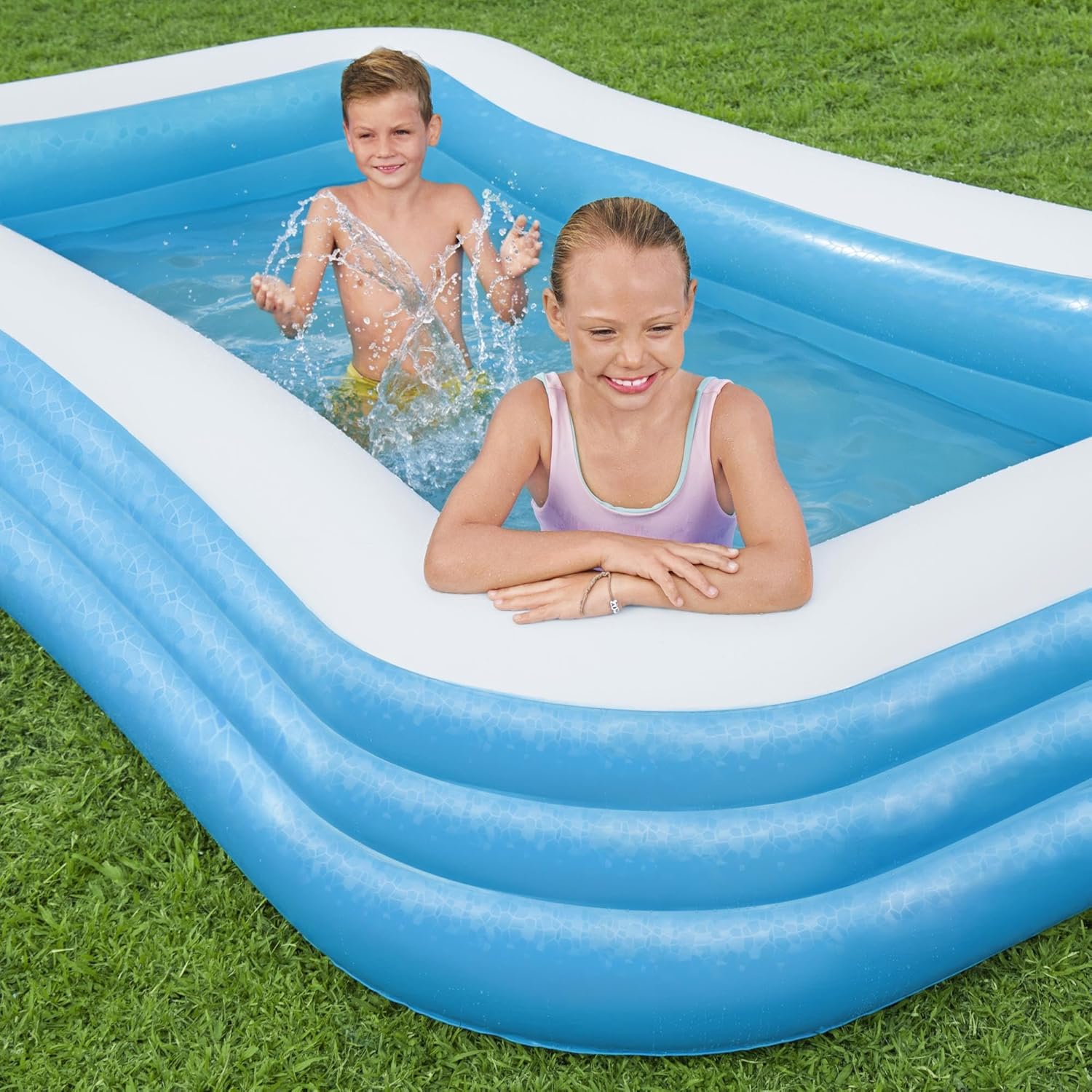 Bestway 54009 inflatable paddling pool with kids
Top view of family in Bestway 10ft blue pool
Bestway family pool in outdoor garden setup
Spacious inflatable pool for backyard fun
Bestway 54009 kids pool with drain valve