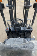 CanLift 4000 LBS orange electric forklift with 118” lift and 42” forks
Profile shot of forklift with raised mast and battery housing
Rear view of forklift with control panel and operator seat
42” heavy-duty forks and solid tires
Close-up of fork shifting mechanism