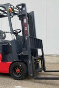CanLift 4000 LBS orange electric forklift with 118” lift and 42” forks
Profile shot of forklift with raised mast and battery housing
Rear view of forklift with control panel and operator seat
42” heavy-duty forks and solid tires
Close-up of fork shifting mechanism