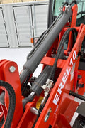 CanLift EREL10 electric wheel loader side view
Red electric wheel loader lifting materials
Bobcat-style quick hitch on CanLift loader
72V battery electric loader in warehouse
Heavy-duty compact loader with bucket attachment