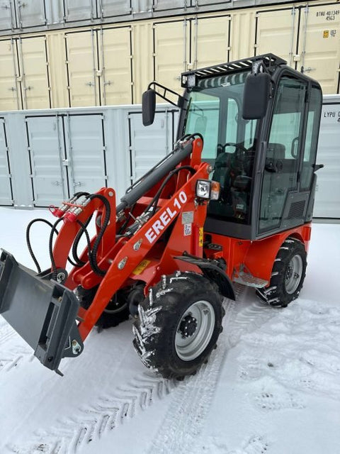CanLift EREL10 electric wheel loader side view
Red electric wheel loader lifting materials
Bobcat-style quick hitch on CanLift loader
72V battery electric loader in warehouse
Heavy-duty compact loader with bucket attachment