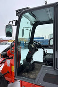 CanLift EREL10 electric wheel loader side view
Red electric wheel loader lifting materials
Bobcat-style quick hitch on CanLift loader
72V battery electric loader in warehouse
Heavy-duty compact loader with bucket attachment