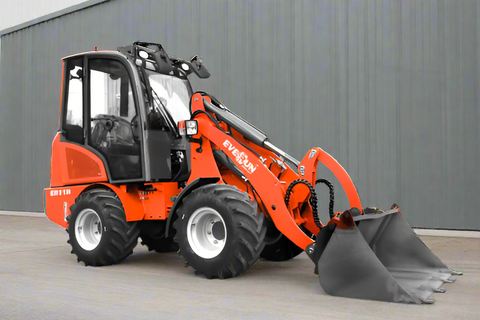 CanLift Mini Wheel Loader with Kubota D1703 engine, orange color – front view
Side view of CanLift compact loader with closed cabin and bucket raised
CanLift mini loader in operation – orange machine on construction site
