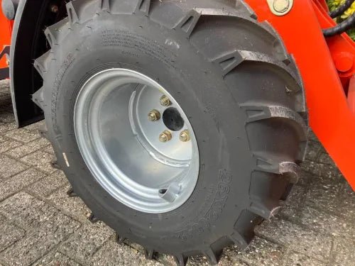 CanLift Mini Wheel Loader with Kubota D1703 engine
Orange and gray wheel loader with enclosed cabin
Compact loader with quick hitch and bucket
Mini loader for snow removal and landscaping
Hydrostatic drive mini loader with joystick control