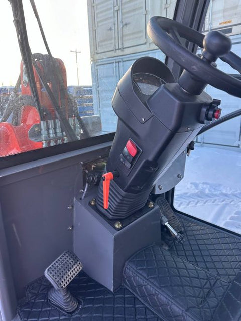 CanLift Mini Wheel Loader with Kubota D1703 engine, orange color – front view
Side view of CanLift compact loader with closed cabin and bucket raised
CanLift mini loader in operation – orange machine on construction site