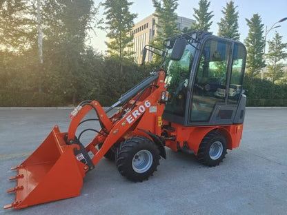 CanLift Mini Wheel Loader with Kubota D1703 engine
Orange and gray wheel loader with enclosed cabin
Compact loader with quick hitch and bucket
Mini loader for snow removal and landscaping
Hydrostatic drive mini loader with joystick control