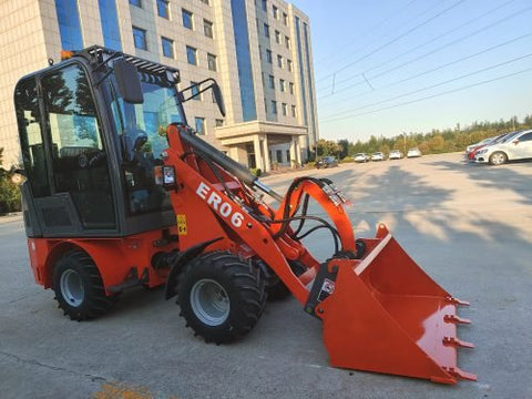 CanLift Mini Wheel Loader with Kubota D1703 engine
Orange and gray wheel loader with enclosed cabin
Compact loader with quick hitch and bucket
Mini loader for snow removal and landscaping
Hydrostatic drive mini loader with joystick control