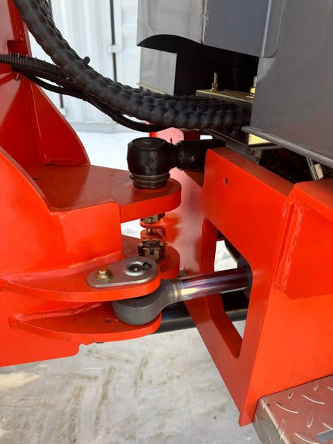 CanLift Mini Wheel Loader with Kubota D1703 engine, orange color – front view
Side view of CanLift compact loader with closed cabin and bucket raised
CanLift mini loader in operation – orange machine on construction site