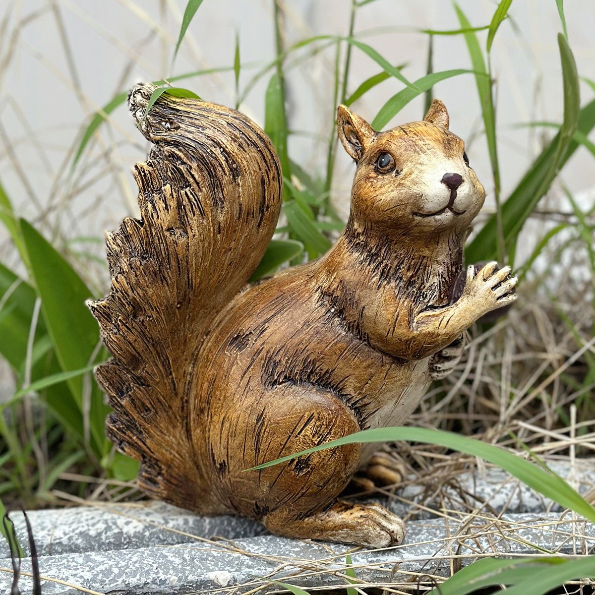 “Realistic squirrel statue for garden decor”

“Lawn ornament of wildlife squirrel in outdoor setting”

“Clever garden squirrel figurine sitting on grass”

“Outdoor backyard squirrel sculpture – brown and natural tone”

“Weatherproof squirrel statue for patio or lawn”

