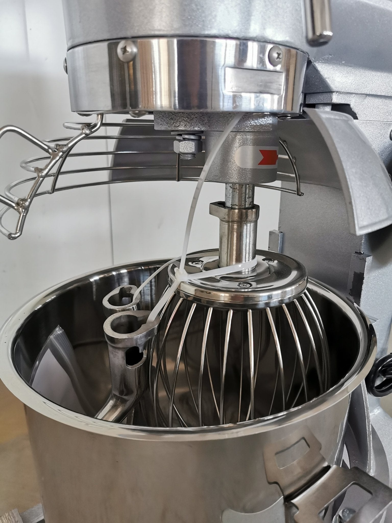 15 QT commercial dough mixer on stainless steel counter

Stainless steel mixing bowl with guard closed

Front view of food-grade commercial mixer with attachments

Dough hook installed on industrial kitchen mixer