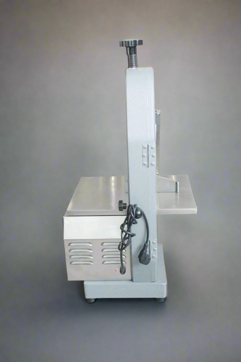 Main view of stainless steel meat and bone cutting saw machine

Compact commercial meat saw for kitchen or butcher use

Electric bone saw with sliding tray and safety guard

Replacement blade for commercial bone saw machine

Close-up of saw handle and stainless construction