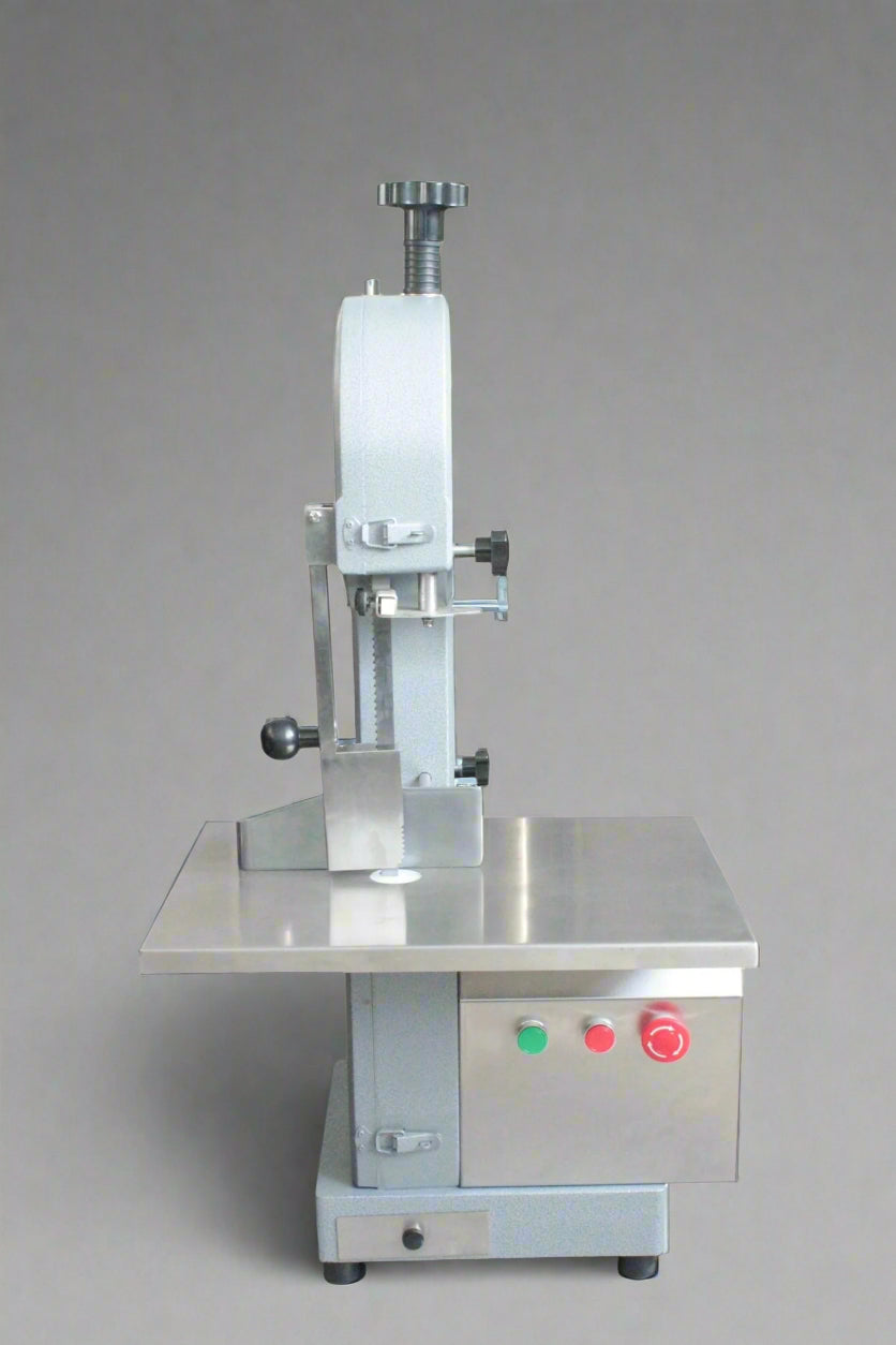 Main view of stainless steel meat and bone cutting saw machine

Compact commercial meat saw for kitchen or butcher use

Electric bone saw with sliding tray and safety guard

Replacement blade for commercial bone saw machine

Close-up of saw handle and stainless construction
