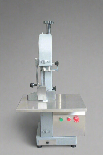 Main view of stainless steel meat and bone cutting saw machine

Compact commercial meat saw for kitchen or butcher use

Electric bone saw with sliding tray and safety guard

Replacement blade for commercial bone saw machine

Close-up of saw handle and stainless construction