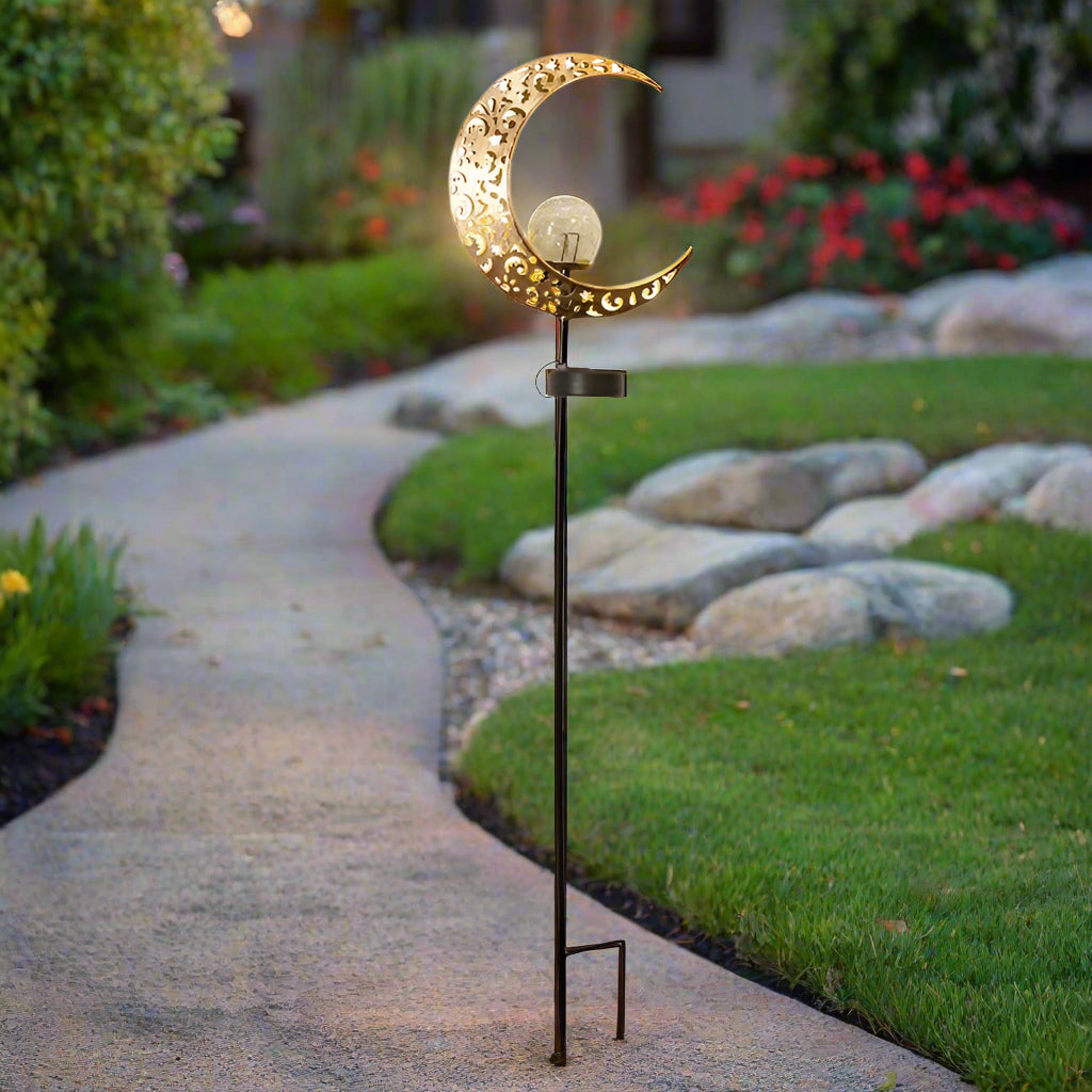 Crescent moon shaped solar LED light for garden pathway
Warm white crackle glass orb on solar-powered metal stand
Outdoor crescent moon decor light with solar panel
Elegant crackle glass garden light at night glowing warm white
Solar crescent garden light illuminating flower bed