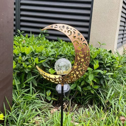 Crescent moon shaped solar LED light for garden pathway
Warm white crackle glass orb on solar-powered metal stand
Outdoor crescent moon decor light with solar panel
Elegant crackle glass garden light at night glowing warm white
Solar crescent garden light illuminating flower bed