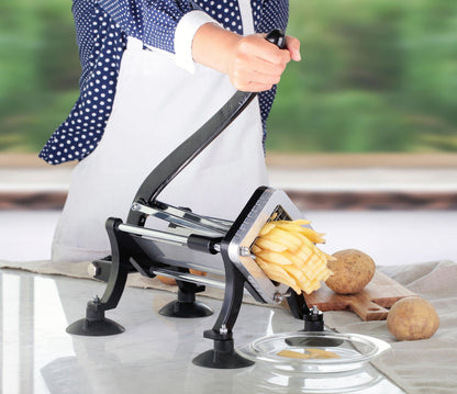 Manual potato slicer in action cutting fresh fries with ergonomic handle