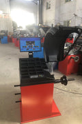 Deluxe red wheel balancer machine with HD LCD screen

Tire balancing machine in auto shop with digital interface

Close-up of WB300A wheel balancer control screen

Precision wheel balancing tool for auto repair garages

