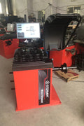 Deluxe red wheel balancer machine with HD LCD screen

Tire balancing machine in auto shop with digital interface

Close-up of WB300A wheel balancer control screen

Precision wheel balancing tool for auto repair garages

