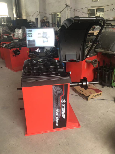 Deluxe red wheel balancer machine with HD LCD screen

Tire balancing machine in auto shop with digital interface

Close-up of WB300A wheel balancer control screen

Precision wheel balancing tool for auto repair garages

