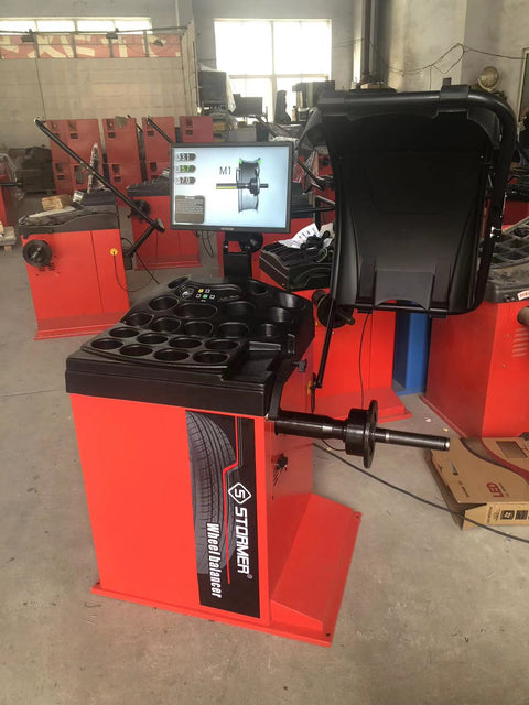 Deluxe red wheel balancer machine with HD LCD screen

Tire balancing machine in auto shop with digital interface

Close-up of WB300A wheel balancer control screen

Precision wheel balancing tool for auto repair garages

