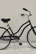 Side view of Deviant 26" beach cruiser bicycle in matte black

Close-up of comfort seat and handlebar grips

Rear coaster brake and single-speed drivetrain

Full assembled view of the Deviant black cruiser bike

Cruiser bike parked on a path at sunset