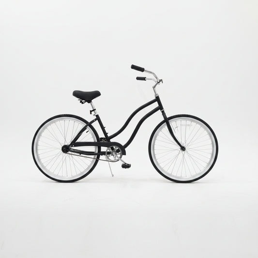Side view of Deviant 26" beach cruiser bicycle in matte black

Close-up of comfort seat and handlebar grips

Rear coaster brake and single-speed drivetrain

Full assembled view of the Deviant black cruiser bike

Cruiser bike parked on a path at sunset