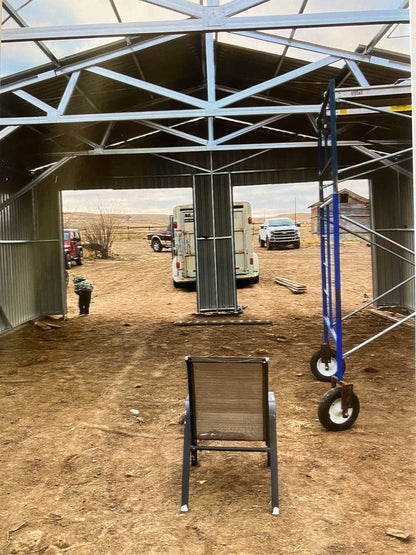 Double steel garage with roll-up doors, outdoor view

Interior view of metal garage barn frame

Roll-up electric overhead doors included in garage

Galvanized steel shed for vehicle and farm storage

Multiple-size all-weather garage options