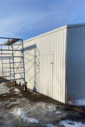 Double steel garage with roll-up doors, outdoor view

Interior view of metal garage barn frame

Roll-up electric overhead doors included in garage

Galvanized steel shed for vehicle and farm storage

Multiple-size all-weather garage options