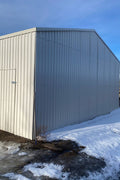 Double steel garage with roll-up doors, outdoor view

Interior view of metal garage barn frame

Roll-up electric overhead doors included in garage

Galvanized steel shed for vehicle and farm storage

Multiple-size all-weather garage options